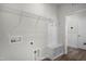 New laundry room features a shelving rack, coat rack, and convenient built-in bench at 545 Beacon Hill Rd # 32, Lillington, NC 27546