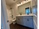 Bathroom featuring a double vanity with modern fixtures, toilet, and bathtub with shower at 604 Hyperion Aly, Wake Forest, NC 27587