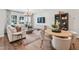 Bright living room featuring a large sofa, stylish decor, and a dining table at 604 Hyperion Aly, Wake Forest, NC 27587