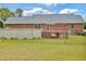 Backyard featuring a brick house and above-ground pool with a deck at 6042 Elliott Bridge Rd, Linden, NC 28356
