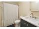 Modern bathroom with a vanity, marble countertop, and a shower-tub combination separated by a shower curtain at 6042 Elliott Bridge Rd, Linden, NC 28356
