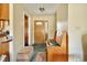 Cozy entryway with bench seating and decorative wood door leading to the rest of the home at 6042 Elliott Bridge Rd, Linden, NC 28356