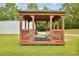 Wooden gazebo with benches and chairs, ideal for outdoor relaxation at 6042 Elliott Bridge Rd, Linden, NC 28356