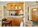 Kitchen with breakfast bar, stainless steel appliances, and oak cabinets that provide lots of storage space at 6042 Elliott Bridge Rd, Linden, NC 28356