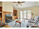 Bright living room featuring a fireplace, custom built-in shelving, and sliding doors to the outdoor area at 6042 Elliott Bridge Rd, Linden, NC 28356