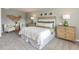 Relaxing main bedroom featuring neutral walls and carpet, woven decor and stylish matching lamps at 641 White Birch Ln, Angier, NC 27501