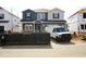 New construction home with mixed siding; construction van parked in front at 659 White Birch Ln, Angier, NC 27501