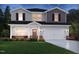 Charming new construction home featuring a two-car garage and professionally landscaped yard at 659 White Birch Ln, Angier, NC 27501