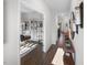 Inviting hallway featuring hardwood floors and an open doorway to the living room at 659 White Birch Ln, Angier, NC 27501