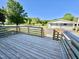The back deck features wood construction and a view of the garage at 668 Surl Mount Tirzah Rd, Timberlake, NC 27583