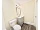 Bathroom with a new toilet, modern vanity with chrome hardware and decorative lighting at 668 Surl Mount Tirzah Rd, Timberlake, NC 27583