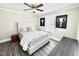 Well-lit bedroom with neutral paint, a decorative bed, and unique wall art at 668 Surl Mount Tirzah Rd, Timberlake, NC 27583