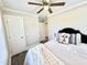 Bedroom featuring a ceiling fan, neutral walls, and black accents with hall access at 668 Surl Mount Tirzah Rd, Timberlake, NC 27583