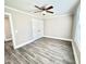 Spacious bedroom with wood-look floors, a closet, ceiling fan and ample natural light at 668 Surl Mount Tirzah Rd, Timberlake, NC 27583