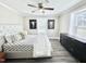 Relaxing bedroom with ceiling fan, modern furnishings, and neutral colors at 668 Surl Mount Tirzah Rd, Timberlake, NC 27583