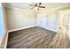 Spacious bedroom offering ample closet space, sleek hardwood floors, a ceiling fan, and natural light at 668 Surl Mount Tirzah Rd, Timberlake, NC 27583