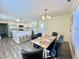 Open floor plan with dining area adjacent to kitchen with marble countertops at 668 Surl Mount Tirzah Rd, Timberlake, NC 27583