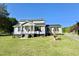 Charming two-story home with a well-manicured lawn, inviting front porch, and driveway at 668 Surl Mount Tirzah Rd, Timberlake, NC 27583
