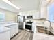 Charming kitchen features stainless steel appliances, marble counters, and plenty of cabinet storage at 668 Surl Mount Tirzah Rd, Timberlake, NC 27583