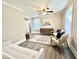Relaxing living room with a futon, chairs, wood-look floors, and modern decor at 668 Surl Mount Tirzah Rd, Timberlake, NC 27583