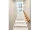 Staircase featuring modern white wood stairs with a light wood railing going up to the next level at 668 Surl Mount Tirzah Rd, Timberlake, NC 27583