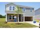 Charming two-story home featuring an attached two-car garage and newly installed green lawn at 677 White Birch Ln, Angier, NC 27501
