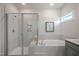 Modern bathroom with a glass-enclosed shower, soaking tub, and stylish fixtures, designed for relaxation at 681 Beacon Hill Rd # 38, Lillington, NC 27546