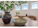 Charming dining area with wood table, stylish chairs, and bright natural light from a trio of windows at 681 Beacon Hill Rd # 38, Lillington, NC 27546