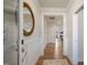 Inviting entryway featuring decorative mirror, wainscoting, and hardwood floors leading into the open-concept living area at 681 Beacon Hill Rd # 38, Lillington, NC 27546