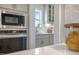 Kitchen view with updated appliances, bright window, subway tile backsplash, and ample cabinet space at 681 Beacon Hill Rd # 38, Lillington, NC 27546