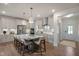 Well-equipped kitchen featuring a large center island with seating, pendant lighting, and stainless steel appliances at 681 Beacon Hill Rd # 38, Lillington, NC 27546