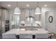 Contemporary kitchen with pendant lighting, white subway tile backsplash, stainless steel appliances, and a center island at 681 Beacon Hill Rd # 38, Lillington, NC 27546