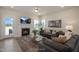 Inviting living room features a cozy fireplace, comfortable seating, and access to the outdoors at 681 Beacon Hill Rd # 38, Lillington, NC 27546