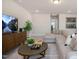 Spacious living room featuring a comfortable sofa and television for relaxation at 681 Beacon Hill Rd # 38, Lillington, NC 27546