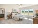 Spacious main bedroom featuring a large window, ensuite bath access, and neutral decor at 681 Beacon Hill Rd # 38, Lillington, NC 27546