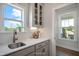 Convenient butler's pantry with white countertops, shaker cabinets, and open access at 681 Beacon Hill Rd # 38, Lillington, NC 27546