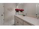 Clean bathroom features a large vanity, white cabinets and a decorative flower arrangement at 7400 Portpatrick Ct, Wake Forest, NC 27587