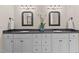 Bathroom featuring a double sink vanity with framed mirrors at 7400 Portpatrick Ct, Wake Forest, NC 27587