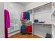 Walk in closet featuring wooden racks,shelving, and hardwood floors at 7400 Portpatrick Ct, Wake Forest, NC 27587