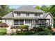 Back exterior of house with multiple windows, a screened-in porch, and a pergola at 7400 Portpatrick Ct, Wake Forest, NC 27587
