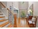 Grand foyer with hardwood floors, stairs, and elegant décor at 7400 Portpatrick Ct, Wake Forest, NC 27587