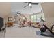 Open bonus room with ample seating, dining area, and fitness equipment at 7400 Portpatrick Ct, Wake Forest, NC 27587