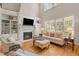 Cozy living room with fireplace, built-in shelving, and ample natural light at 7400 Portpatrick Ct, Wake Forest, NC 27587