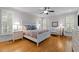 Bright main bedroom features beautiful hardwood floors and neutral walls at 7400 Portpatrick Ct, Wake Forest, NC 27587
