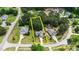 Aerial shot of a single Gathering home and neighborhood surrounded by mature trees at 7405 Pine Summit Dr, Fuquay Varina, NC 27526