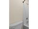 Bathroom showcasing a white toilet and a tub-shower combo with neutral wall color at 7405 Pine Summit Dr, Fuquay Varina, NC 27526