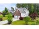 A beautiful two-story home with a brick and vinyl exterior, attached two-car garage, and driveway at 7405 Pine Summit Dr, Fuquay Varina, NC 27526