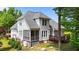 Rear view of home with deck and screened in porch at 7405 Pine Summit Dr, Fuquay Varina, NC 27526
