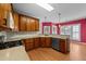 Stylish kitchen with wood cabinets, modern appliances, and sleek countertops for cooking convenience at 7405 Pine Summit Dr, Fuquay Varina, NC 27526