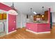 Open concept kitchen with wood cabinets, modern appliances, and easy access to the laundry and staircase at 7405 Pine Summit Dr, Fuquay Varina, NC 27526